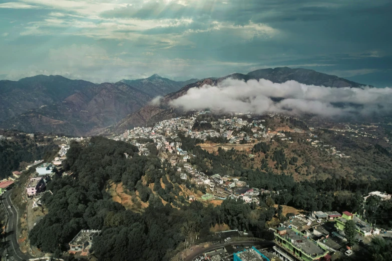 the clouds are rolling in the valleys on the hill