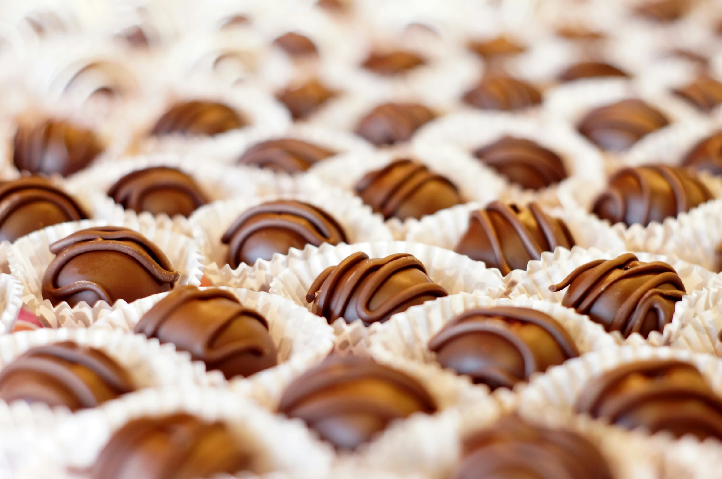 a large display filled with lots of chocolate covered nuts