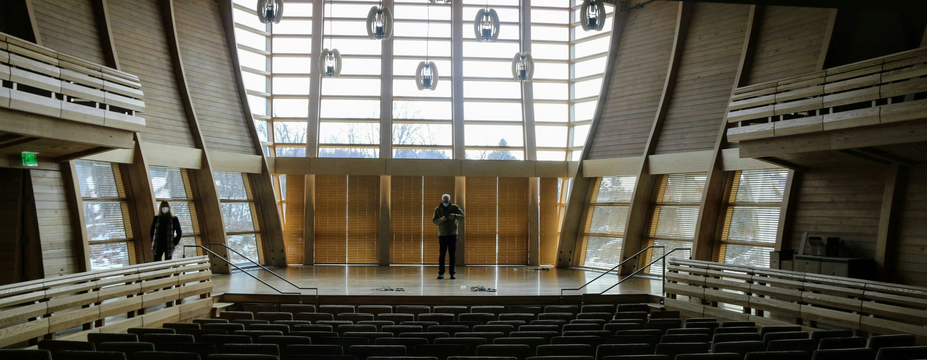 the man is standing in the middle of an empty building