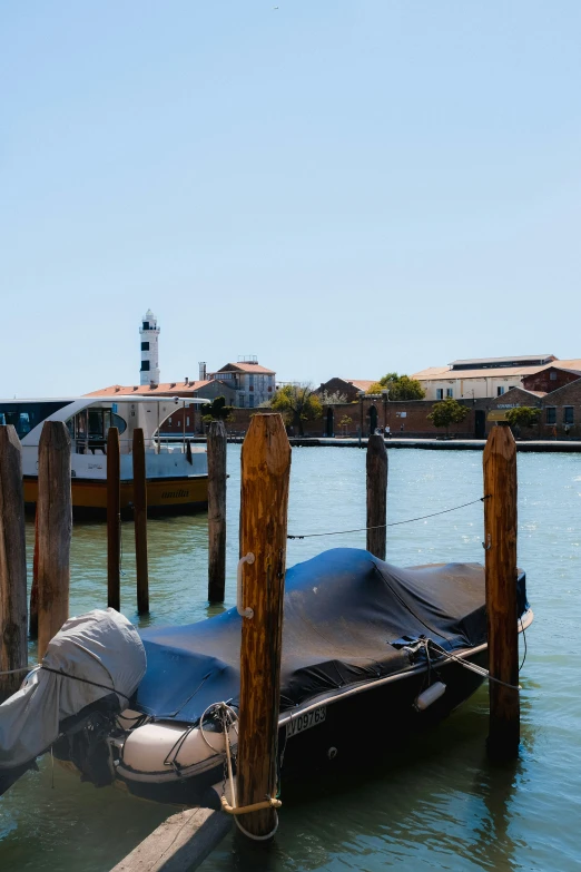 a boat docked in the water near pier