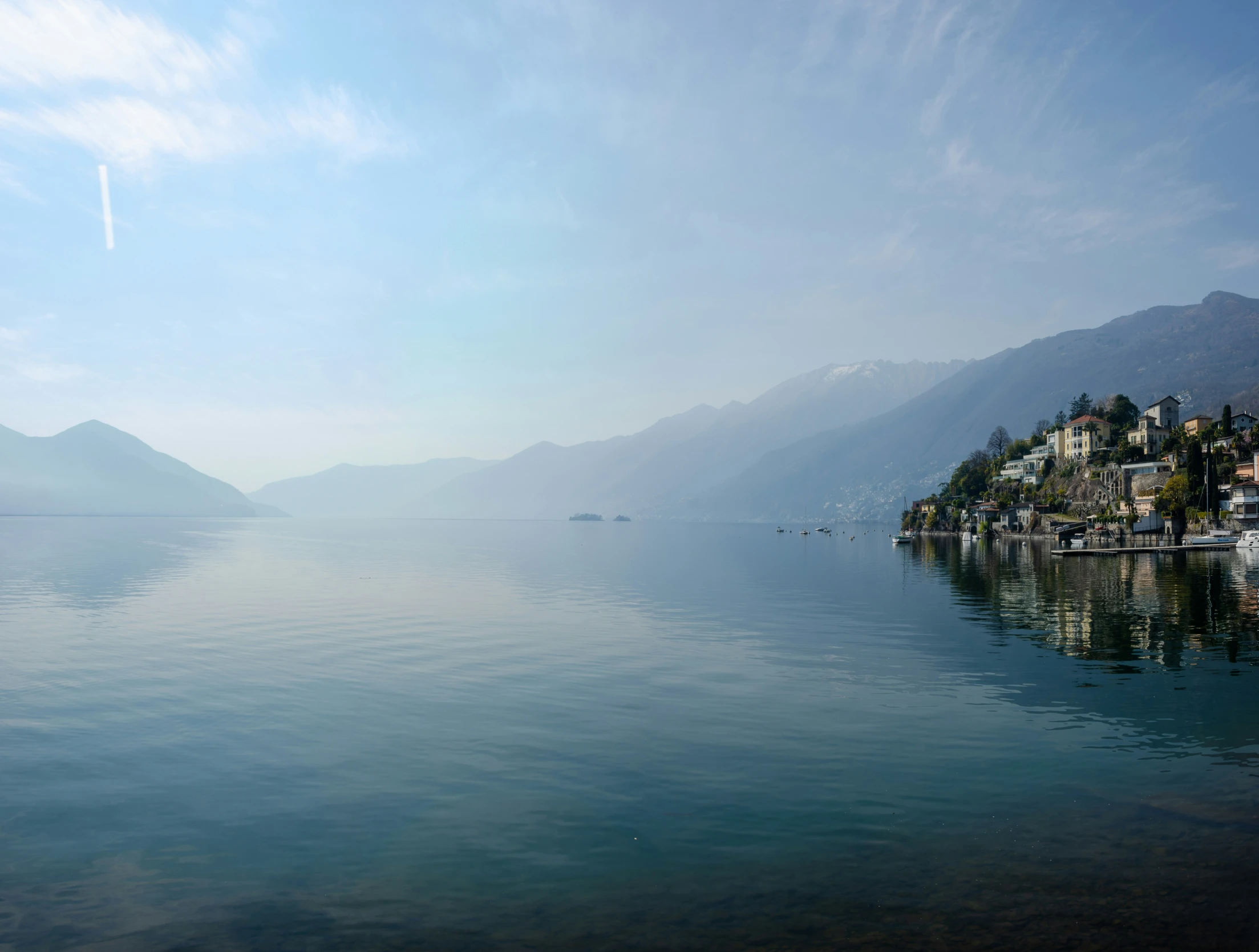 a lake with mountains in the background