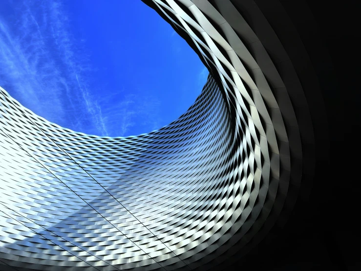 view up into the sky from inside a circular building