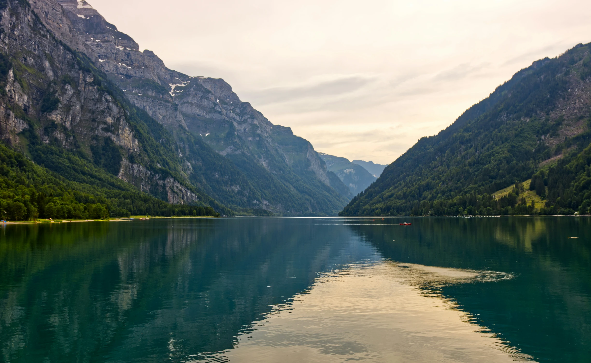 the view of mountains and rivers in europe from across the lake