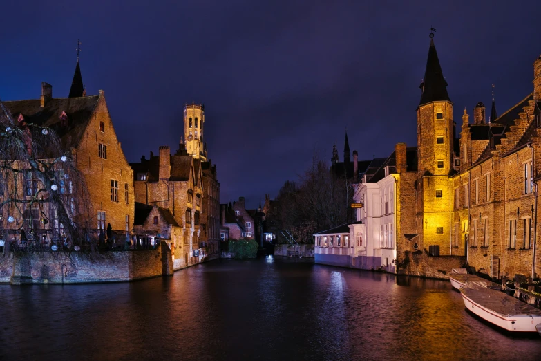 a narrow waterway surrounded by buildings with towers