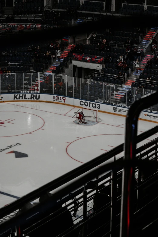 hockey play is playing in the dark on an ice rink