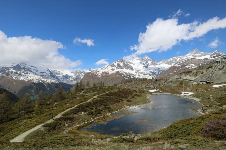 a view of some mountains with some snow on them