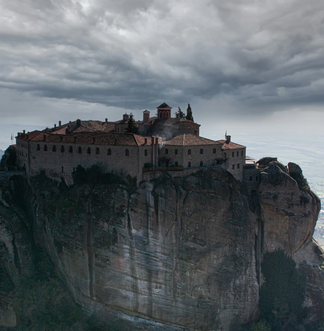 a large castle on top of a cliff