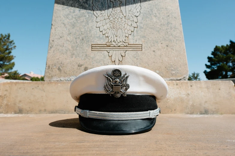 a hat that is laying down next to the monument