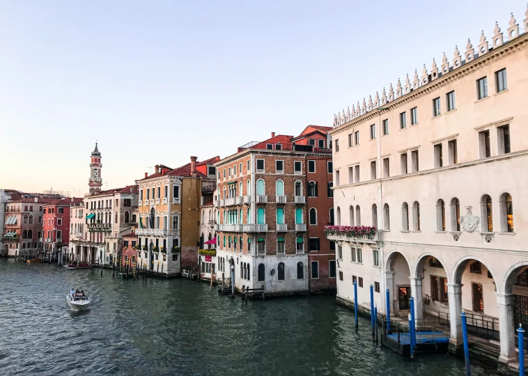 a waterway full of buildings with boats in it