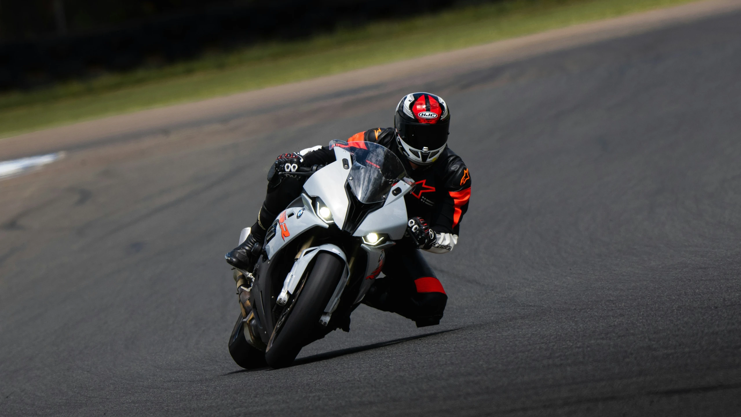 a person riding a motorcycle on a race track