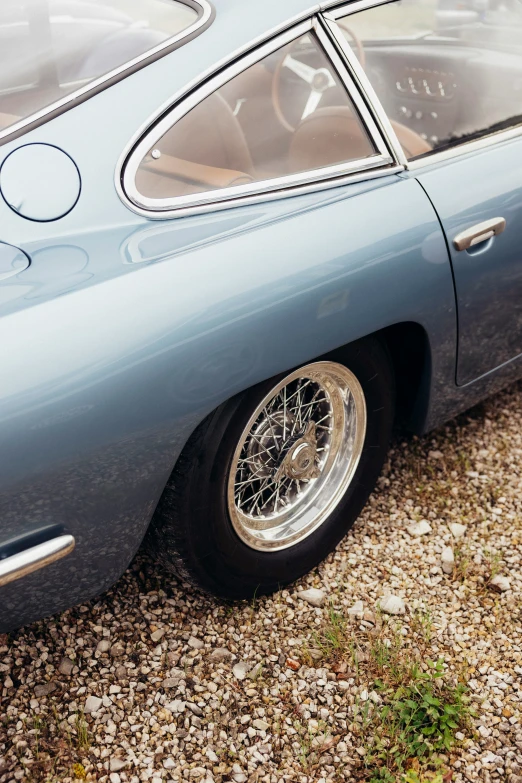 a blue sports car with an open front wheel