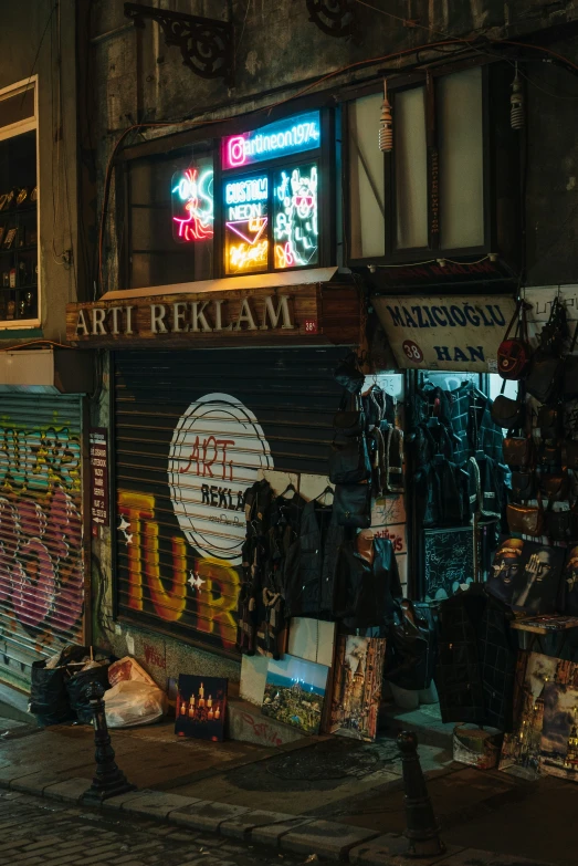 a store front with a neon sign in the window