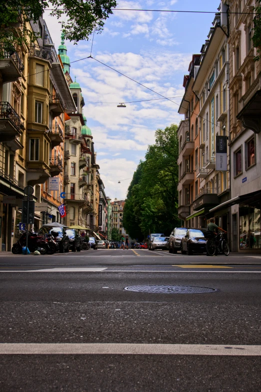 a busy street in a city with tall buildings