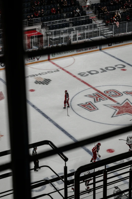 a hockey game in progress, from behind the net