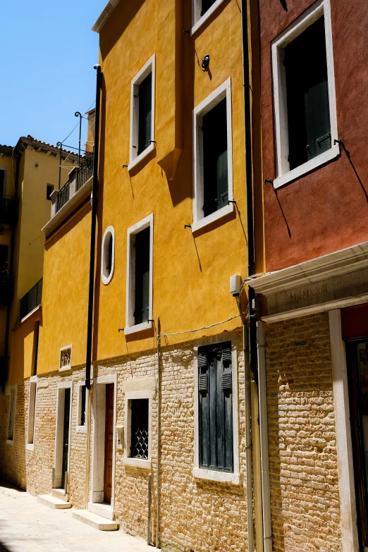 the buildings have a red and yellow exterior