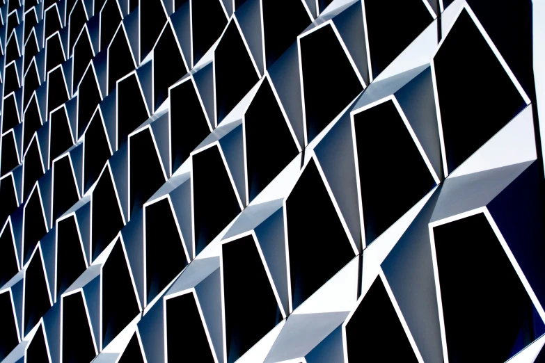 a close up view of a wall with black squares