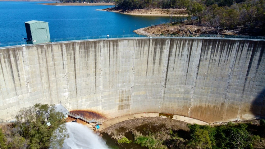 a dam wall that is on a body of water