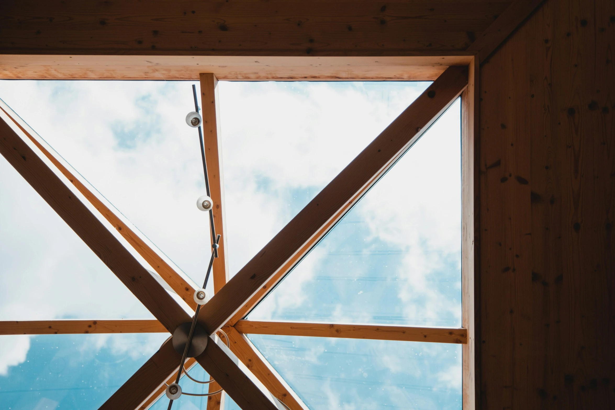 the sky seen through a roof in a building