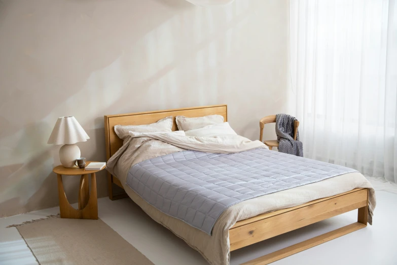 a bedroom with the bed with a wooden frame