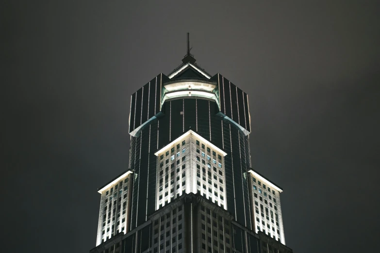 the top of the building illuminated at night