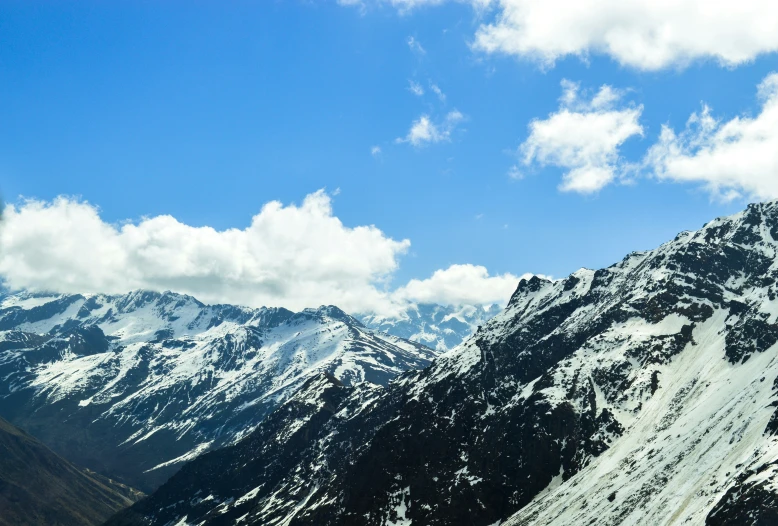 snow covered mountains and the sky behind them