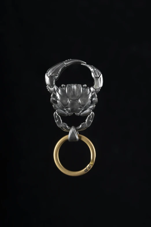 an ornate antique silver and yellow gold ring