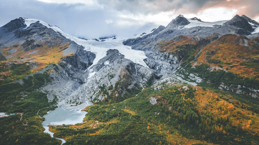 a mountain with a small lake on the side