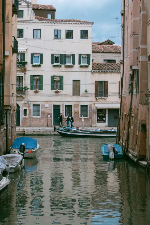 a river in an urban setting with boats on it