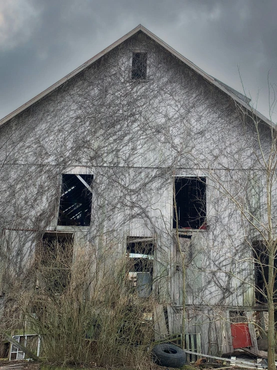 an old abandoned house with several windows