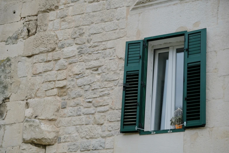 a view of a window and the shutters open
