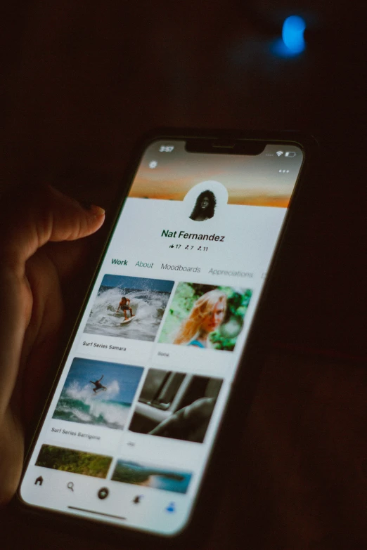 a person holding up a phone with a cell phone screen