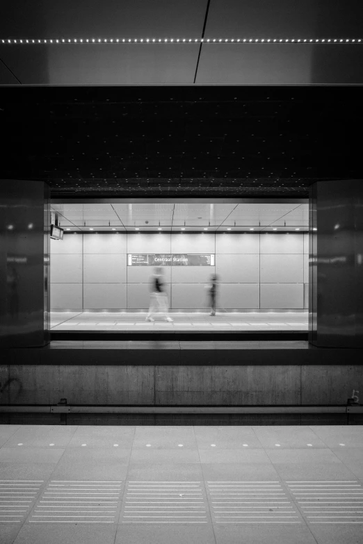 a black and white po of people in the subway