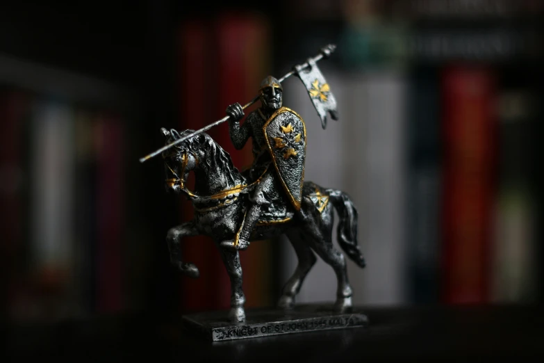 figurines of knights on horses are positioned on bookshelves