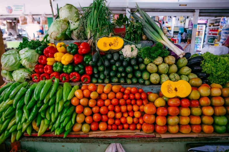 a large selection of fruits and vegetables are shown