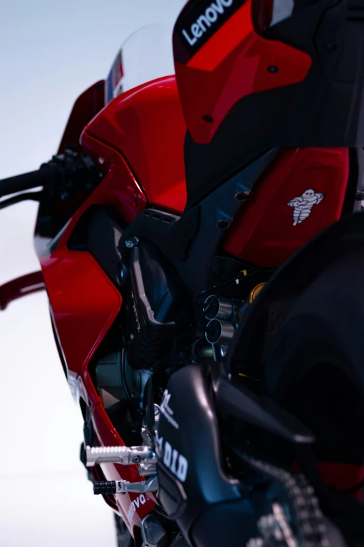 a red motorcycle is parked beside another bike