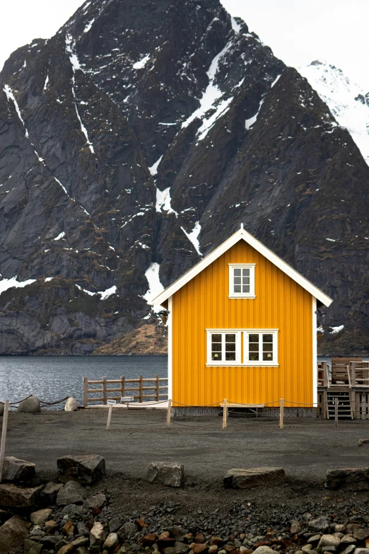 a yellow house near a body of water