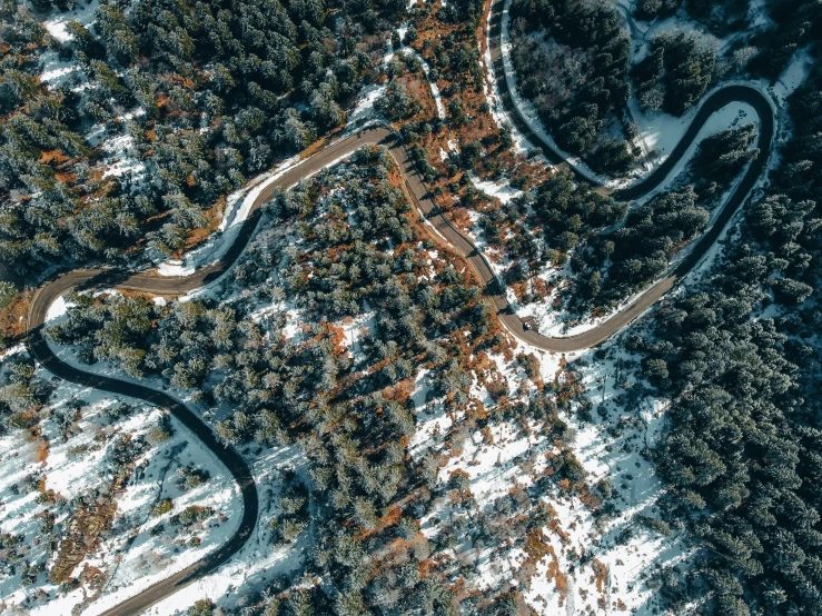 an aerial view of the top of the mountains in winter