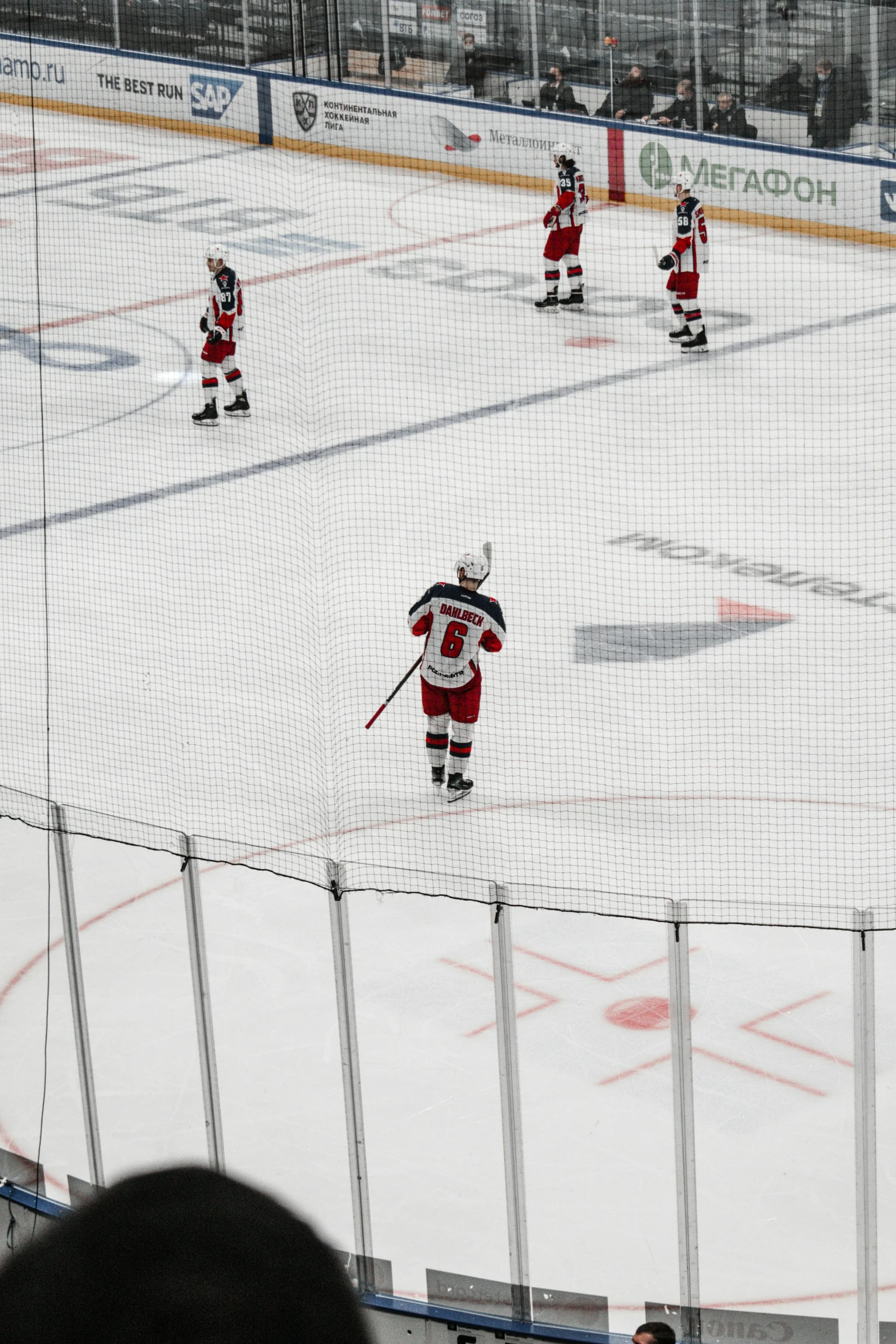 several people playing hockey in an arena