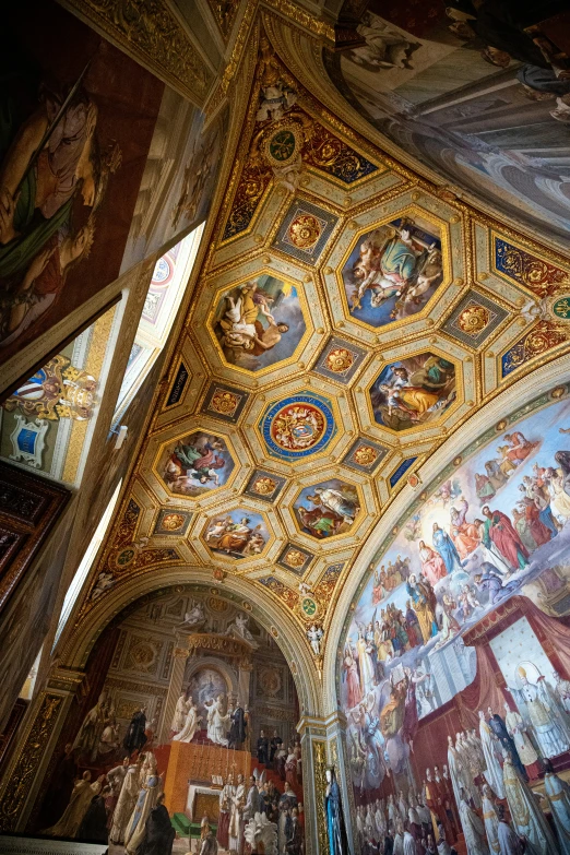 several paintings on the ceiling in a large room