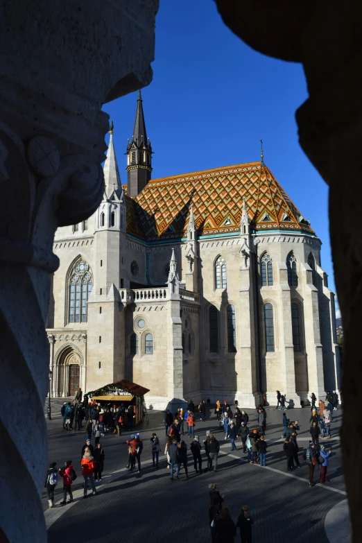 several people are gathered outside of the cathedral