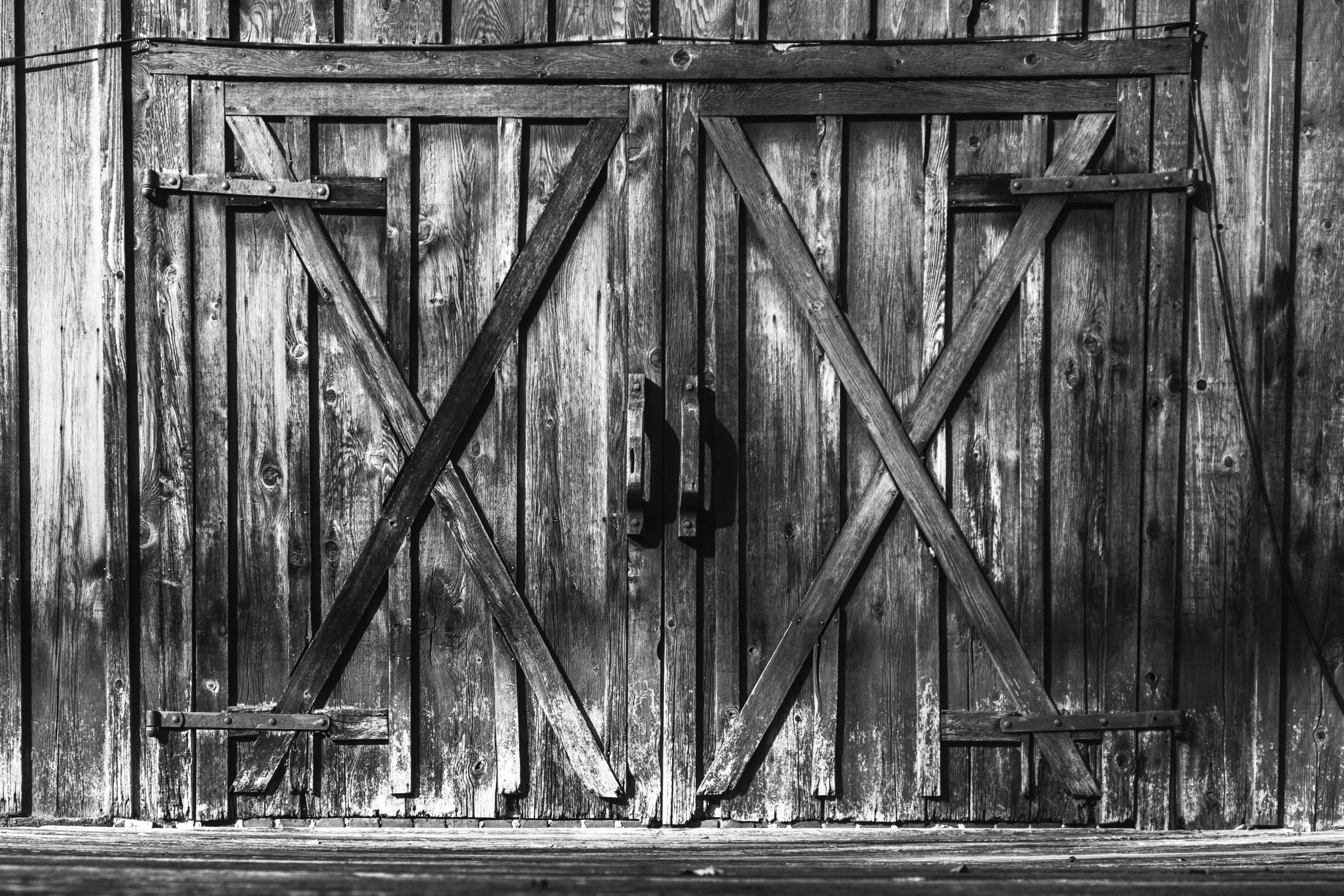 a wooden gate made out of multiple pieces of wood