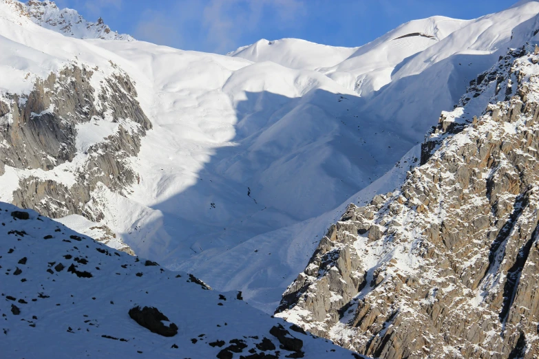 a mountain with some snow in it's mountains