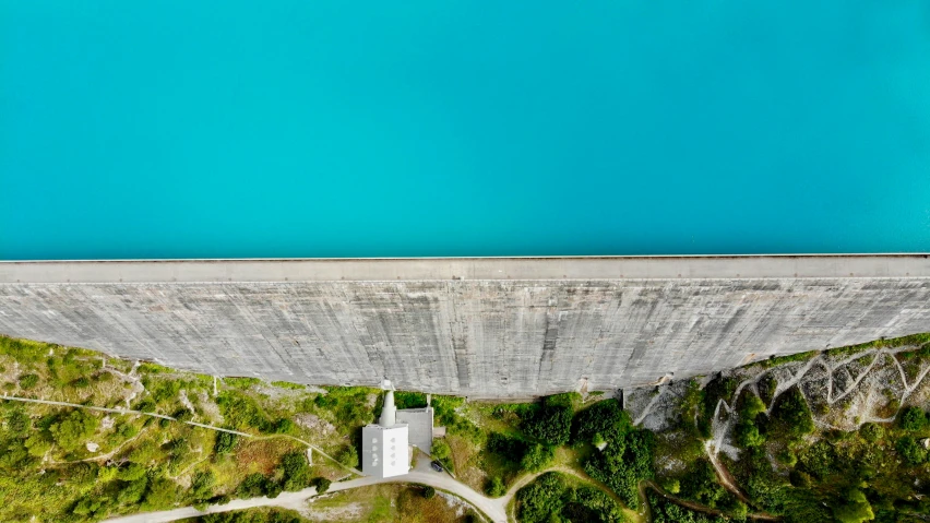 aerial s of the water flowing down a dam