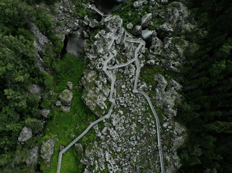 an aerial view of the woods and rocks