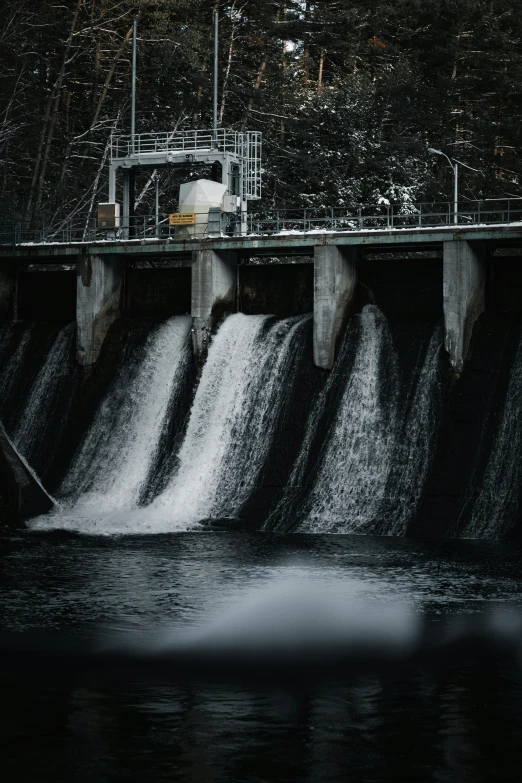 an image of the water flowing over a dam