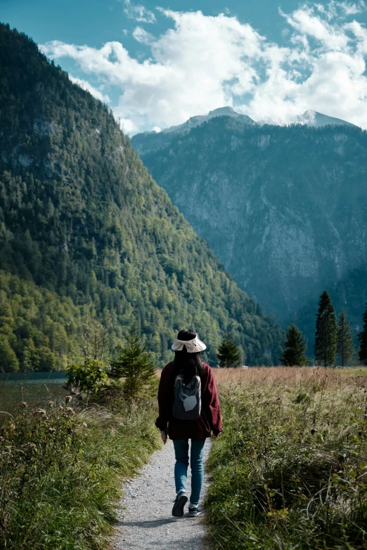 man hiking in the mountains, the mountains are visible