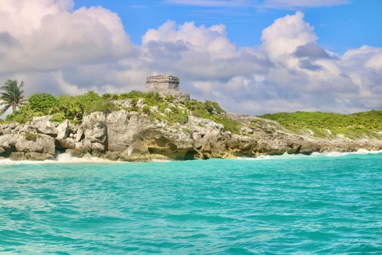 a small island surrounded by greenery and water