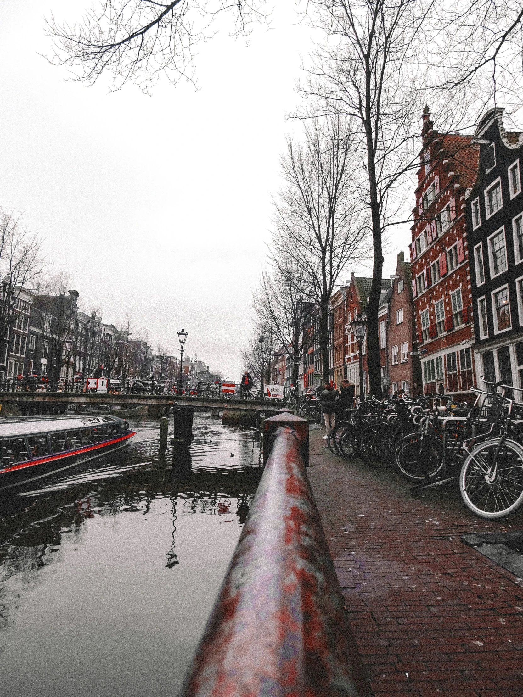 a canal running between several buildings in the distance