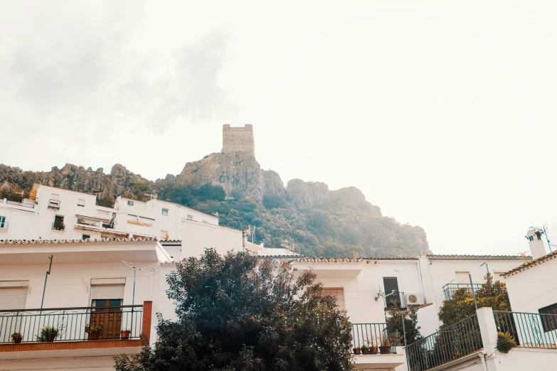 several balconies with a view of a castle on top