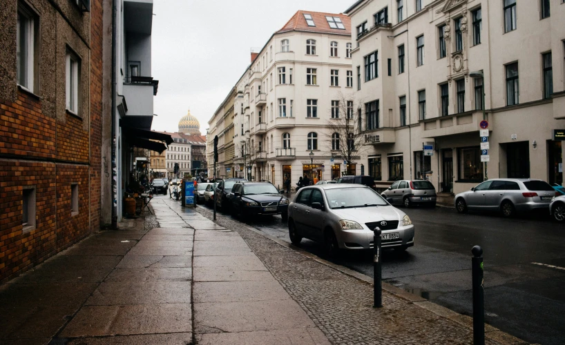 the cars are parked on the side of the road